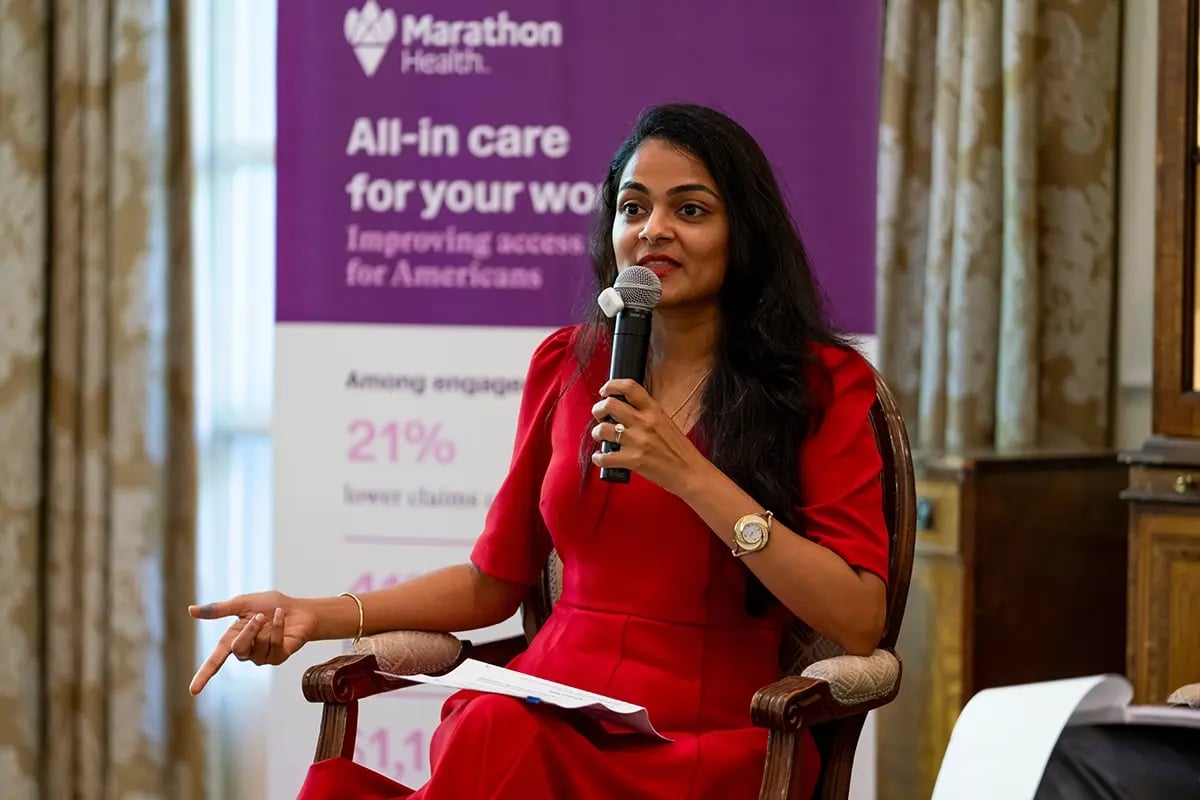 Dimple Ajmera speaking on stage.