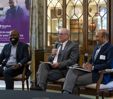 Three professionals on a panel at a Marathon Health event in Charlotte.
