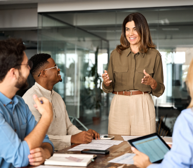 Employer discussing self-funded insurance with a small group of employees.