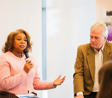 Two people speaking at a panel event in Columbus.