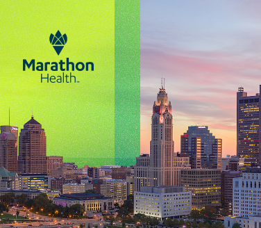 Marathon Health logo on a bright green overlay beside a Columbus, Ohio skyline at dusk with illuminated high-rise buildings