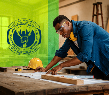 IBEW Local 38 logo over a person in safety glasses reviewing plans on a workbench beside a hard hat
