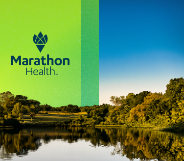 Marathon Health logo on a green panel above a tree-lined lake